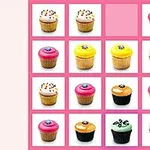 Et 4x4 gitter af diverse dekorerede cupcakes med lyserød baggrund