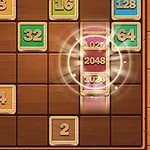 Et brætspil med farvede nummererede firkanter, hvor nogle er stablet, og tallet 2048 er centreret med en glødende effekt