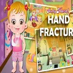 Tegningen viser en glad baby med pigtails og forbinding, omgivet af billeder af hospitalscener og teksten Hand Fracture