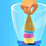 En hånd placerer en vaffelis med forskellige farver lag i en blender på en blå baggrund