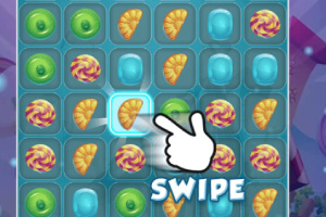 Et spilbræt med farverige slik-ikoner og en pegende hånd, der viser en swipe-bevægelse
