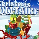 En kane fyldt med julegaver i snevejr med teksten Christmas Solitaire øverst på billedet