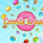 Farverig donut i centrum med forskellige småkager og slik omgivet af blå himmel