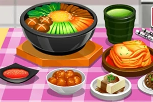 En række asiatiske retter, inklusive en stor skål med suppe og grøntsager, flere små retter og en grøn drik, placeret på en ternet pink dug