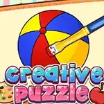 En farverig illustration af en bold, der bliver malet med pensel, med teksten creative puzzle nedenunder, omgivet af en notesbog
