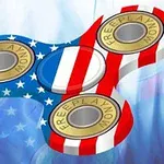 En fidget spinner med amerikanske flagfarver og FREEPLAYNOW skrevet på dens vægte
