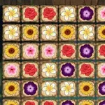 Farvet mønster af forskellige blomster i et gitterlayout
