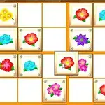 Blomster i forskellige farver placeret i et grid på 5x5 felter med tomme og fyldte positioner