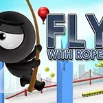 Sort tegneseriefigur svinger i et reb mellem høje, blå bygninger med en rød bro i baggrunden og teksten Fly With Rope 2