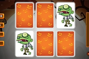 Seks spillekort med orange græskarmotiver, hvoraf to afslører en tegneserieagtig zombiefigur