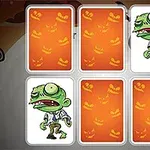 Seks spillekort med orange græskarmotiver, hvoraf to afslører en tegneserieagtig zombiefigur