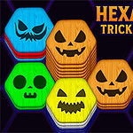Hexa Sort Trick or Treat Farverige sekskantede brikker med udskårne græskaransigter og en zombiefinger mod en lilla baggrund