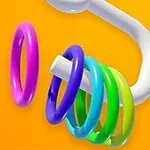 Farverige ringe på en buet hvid holder mod en orange baggrund