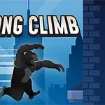 Silhuet af en klatrende abe foran en bysilhuet med teksten KONG CLIMB øverst