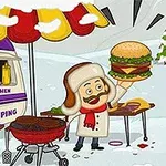 Mand i vinterbeklædning laver burger ved en grill ved siden af en campingvogn i sneen