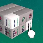 Tredimensionel kube bestående af mahjong-brikker med en animeret hånd, der peger på en af brikkerne