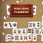 Mahjong-brikker arrangeret med blomsterkanter og teksten Mahjong Flowers i midten