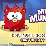 Rødt tegneserieagtigt væsen med store øjne, tekst MINI MUNCHER og chokoladeelementer