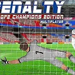 En fodboldmålmand i grå dragt kaster sig for at redde en bold, mens en anden spiller i hvidt skyder mod målet på en stadion
