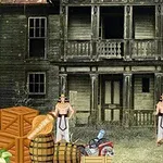 To mænd står foran et gammelt, forfaldent hus med kasser, tønder og en gammel bil i forgrunden