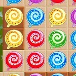 Flerfarvede, spiralformede bolcher er arrangeret i et gittermønster
