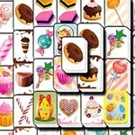 Et mønster af farverige fliser med illustrationer af kager, slik og desserter i et tætpakket layout