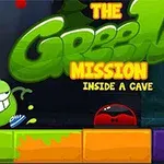 En grøn karakter med et smilende ansigt og sko står ved siden af farverige blokke med teksten The Green Mission Inside a Cave i baggrunden