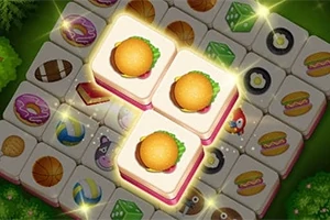 Tre belyste flisebrikker med burgerbilleder omgivet af forskellige motiver som madvarer og objekter