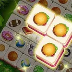 Tre belyste flisebrikker med burgerbilleder omgivet af forskellige motiver som madvarer og objekter