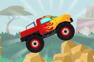 En rød og gul monstertruck med flammedesign kører over sten i et tegneserielandskab med træer i baggrunden